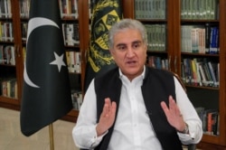 Pakistan's Foreign Minister Shah Mehmood Qureshi gestures as he speaks during an interview with Reuters in Islamabad, Pakistan June 25, 2020.