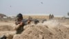 FILE - Iraqi soldiers train with members of the U.S. Army 3rd Brigade Combat Team, 82nd Airborne Division, at Camp Taji, Iraq, in this U.S. Army photo released June 2, 2015. 