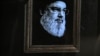 An image of the late leader of Hezbollah Hassan Nasrallah with a black stripe for mourning is displayed on a television set airing a broadcast from the private Lebanese station NBN in Beirut on September 28, 2024.