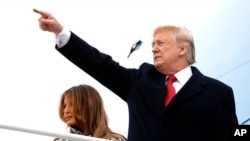President Donald Trump and first lady Melania Trump board Air Force One at Andrews Air Force Base, Md., en route to Paris, Nov. 9, 2018, where they will participate in World War I commemorations.