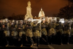 District of Columbia National Guardsmen stand outside the Capitol on Jan. 6, 2021, after a day of rioting Trump supporters.