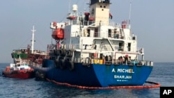 This photo provided by the United Arab Emirates' National Media Council shows the Emirati-flagged bunkering tanker A. Michel off the coast of Fujairah, United Arab Emirates, May 13, 2019. 