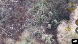 ཕྱི་ཟླ་དང་པོའི་ཚེས་༡༡་ཉིན་བརྒྱབ་པའི་ཀོར་སི་ཀ་མངའ་ཁུལ་དུ་དཔུང་གྲོགས་སུ་འབྱོར་བའི་བྱང་ཀོ་རི་ཡའི་དམག་མི་ཁག་ཅིག་གི་འདྲ་པར།