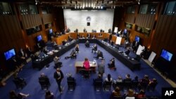 Supreme Court nominee Amy Coney Barrett arrives for her Senate Judiciary Committee confirmation hearing on Capitol Hill in Washington, Oct. 12, 2020.