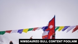 Nirmal "Nims" Purja, Dawa Tenji Sherpa (team MG), Mingma G, Dawa Temba Sherpa and Pem Chiri Sherpa, Mingma David Sherpa, Mingma Tenzi Sherpa, Nimsdai Purja and Gelje Sherpa are seen before the winter attack on K2, Pakistan, Jan. 5, 2021.