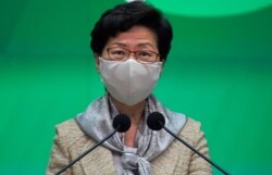 Hong Kong Chief Executive Carrie Lam listens to reporter's question during a press conference in Hong Kong, Tuesday, May 19, 2020.