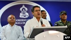 Honduras' President Juan Orlando Hernandez speaks during a press conference at the Presidential House in Tegucigalpa, Aug. 3, 2019.