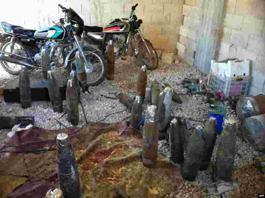 Homemade weapons left by Syrian rebels are pictured, after the army seized control of the city of Qusair and the surrounding region in Syria's central Homs province. 