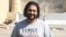 Egyptian pro-democracy activist Alla Abdel Fattah was barred from the court session where he was sentenced to 15 years in prison for protesting a restrictive protest law, Cairo, June 11, 2014. (Hamada Elrasam/VOA) 