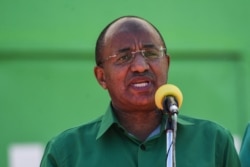 FILE - Then-candidate Hussein Mwinyi speaks at the Jamhuri stadium in Dodoma, Tanzania, Aug. 29, 2020.