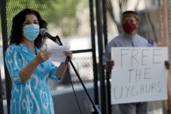 FILE - Rushan Abbas, executive director of Campaign for Uyghurs, speaks to a group gathered near the White House to call on the U.S. government to respond to China's alleged abuses of a Muslim ethnic minority called the Uighurs, July 3, 2020.