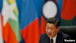 FILE - China's President Xi Jinping speaks at the Dialogue on Strengthening Connectivity Partnership at the Diaoyutai State Guesthouse in Beijing, Nov. 8, 2014. 