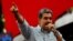 FILE - Venezuelan President Nicolas Maduro speaks at a rally in Caracas on Aug. 28, 2024. The Biden administration said on Nov. 27, 2024, that it imposed sanctions on 21 Venezuelan officials for their part in suppressing protests after a contested presidential election in July.