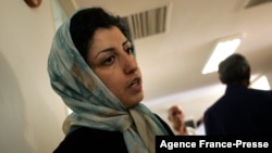 FILE - Iranian opposition rights activist Narges Mohammadi is seen at the Defenders of Human Rights Center in Tehran, Iran, June 25, 2007.