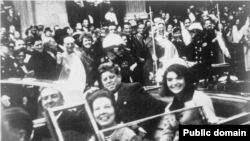 President Kennedy, Jackie Kennedy, and the Connallys in the presidential limousine seconds before the assassination.
