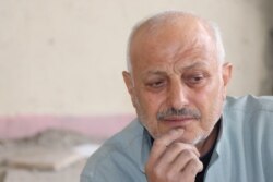 Ahmed Hashem, 60, lost 20 family members in Syria's civil war before witnessing the most gruesome violence he had ever seen in Idlib province, Syria, over the past three months, pictured in Raqqa, Feb. 23, 2020. (Heather Murdock/VOA)