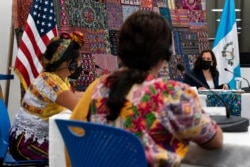 Vice President Kamala Harris, right, listens as women speak to her about their businesses during a meeting with Guatemalan women entrepreneurs and innovators at the Universidad del Valle de Guatemala, June 7, 2021, in Guatemala City.