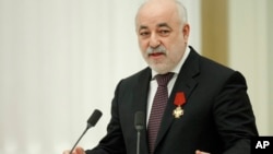 FILE - Viktor Vekselberg speaks in Moscow's Kremlin, Russia, Feb. 21, 2011. One of his associates has been charged with violating sanctions and laundering money in connection with helping Vekselberg maintain his U.S. properties, according to records unsealed on Tuesday.