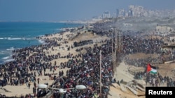 Palestinians, who were displaced to the south at Israel's order during the war, make their way back to their homes in northern Gaza, amid a ceasefire between Israel and Hamas, in the central Gaza Strip, Jan. 27, 2025.