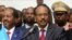 Somalia's newly elected President Mohamed Abdullahi Farmajo flanked by outgoing president Hassan Sheikh Mohamud (L) addresses lawmakers after winning the vote at the airport in Somalia's capital Mogadishu, Feb. 8, 2017.