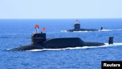 FILE - A nuclear-powered Type 094A Jin-class ballistic missile submarine of the Chinese People's Liberation Army's navy is seen during a military display in the South China Sea, April 12, 2018.