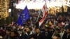FILE - Anti-government demonstrators protest the Georgian government's postponement of European Union accession talks until 2028, outside the parliament in central Tbilisi on Dec. 31, 2024.
