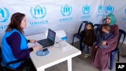 Syrian refugee Bushra, 19, registers at the UNHCR center in the northern city of Tripoli, Lebanon, March 6, 2013. 