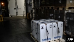 This Dec. 26, 2020, photo shows boxes of Pfizer-BioNTech vaccines at their arrival in France in a central pharmacy on the outskirts of Paris and before being transported to hospitals in Sevran and Dijon.