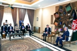 Abdullah Abdullah, chairman of the High Council for National Reconciliation, right, meets with U.S. Secretary of State Antony Blinken, center, and their delegations, at the Sapidar Palace in Kabul, Afghanistan, April 51, 2021.