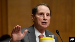 FILE - Sen. Ron Wyden at a Senate Finance Committee hearing on Capitol Hill in Washington, June 30, 2020.