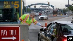FILE - Drivers cross the Benjamin Franklin Bridge between Camden and Philadelphia. For Pope Francis' Sunday Mass in Philadelphia on Sept. 27, the faithful are looking at a several-miles-long walk from Camden over the Ben Franklin Bridge.