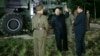 In this image made from video by North Korea's KRT, July 28, 2017, North Korean leader Kim Jong Un gestures at the site of a missile test at an undisclosed location in North Korea.