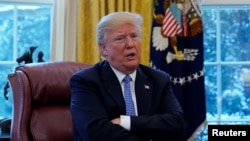 President Donald Trump speaks during an interview with Reuters at the White House in Washington, U.S., January 17, 2018. 