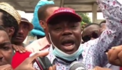 Former Senator Moïse Jean Charles speaks to protesters during a demonstration in Port-au-Prince, Haiti, Dec. 10, 2020. (Renan Toussaint/VOA)