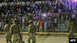 FILE - Somali security forces patrol during a soccer match at Konis Stadium, in Modadishu, Somalia, Sept. 8, 2017. 