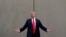 FILE - President Donald Trump speaks during a tour as he reviews border wall prototypes in San Diego, California, March 13, 2018.