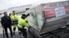 Officials load ballot boxes with votes from expatriates on the constitutional referendum from a truck onto a plane for shipment to Turkey at Tegel airport in Berlin, Germany, April 11, 2017.