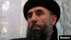 FILE - Gulbuddin Hekmatyar speaks to a reporter in 2007.