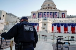 A U.S. Capitol police officer stands on the West Front of the Capitol before Joe Biden's presidential inauguration in Washington, Jan. 20, 2021.