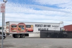 FILE - A truck arrives at Smithfield Foods' pork plant in Smithfield, Virginia, Oct. 17, 2019.