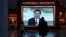FILE - Chinese President Xi Jinping is seen on screen near the slogan "The people's yearning for a better life is the goal we strive for" at the Museum of the Communist Party of China in Beijing, China, Nov. 12, 2021. 