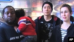 Residents of Japan, such as Lyle Carr (left) and Lidnsay Sakamoto (right), have traveled to the U.S. because of concerns over the nuclear crisis in Japan.