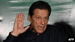 FILE - Former Pakistani Prime Minister Imran Khan speaks to reporters at his residence in Lahore, May 18, 2023. A Pakistani court indicted the jailed Khan and several associates Dec. 5, 2024, for allegedly inciting supporters to attack military installations in 2023.