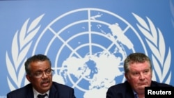 WHO Director-General Tedros Adhanom Ghebreyesus speaks next to Michael J. Ryan, executive director of the WHO Health Emergencies Program, during a news conference at the UN, in Geneva, Jan. 29, 2020.