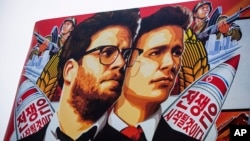 FILE - A banner for the film "The Interview" by Sony Pictures is posted outside a theater in Hollywood, California, December 2014.