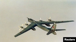 FILE - A Russian Tupolev Tu-95 plane is photographed by the Norwegian Air Force in International waters outside the coast of Norway, Aug. 17, 2007.