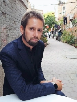 This undated photo at an undisclosed location provided to AFP by the "Chinese Urgent Action Working Group" shows Swedish human rights activist Peter Dahlin.