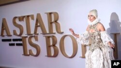 Actress and singer Lady Gaga poses for photographers upon arrival at the premiere of the film "A Star Is Born" in London, Sept. 27, 2018.