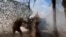 FILE - A Russian soldier fires from a howitzer toward the Ukrainian position in the Russian-Ukrainian border area in ​​the Kursk region, Russia, Oct. 28, 2024, in this photo taken from video released by the Russian Defense Ministry.