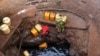 FILE - A woman fetches water from a well near Marsabit in northern Kenya, Sept. 16, 2014. A Kenyan university student from Marsabit County has won a grant to help track expectant mothers in the area.
